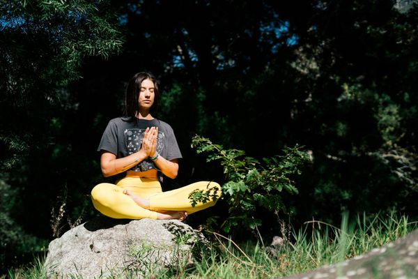 Woman in a tree pose, demonstrating balance and serenity.